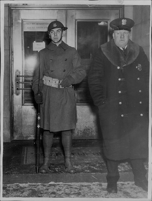 A guard stands at the entrance to the Strutwear Knitting Company